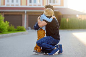 Father Hugging His Son